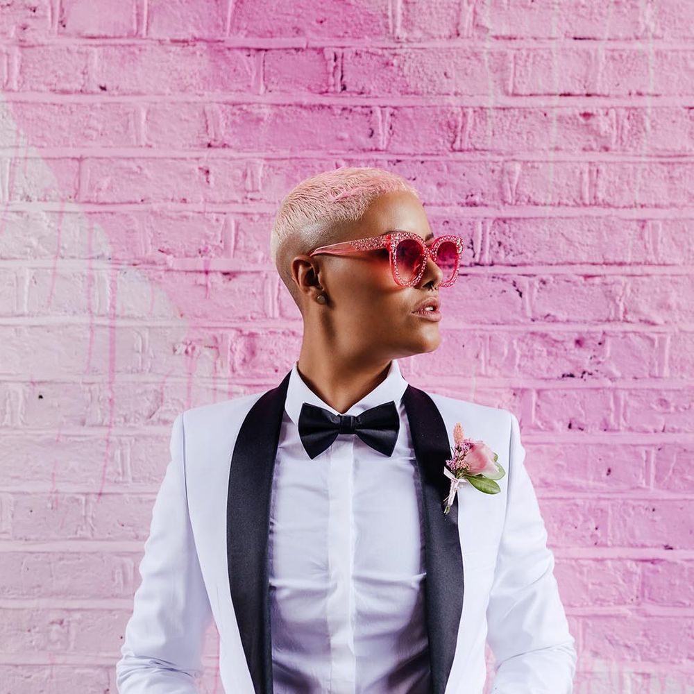 bride wearing statement pink wedding sunglasses