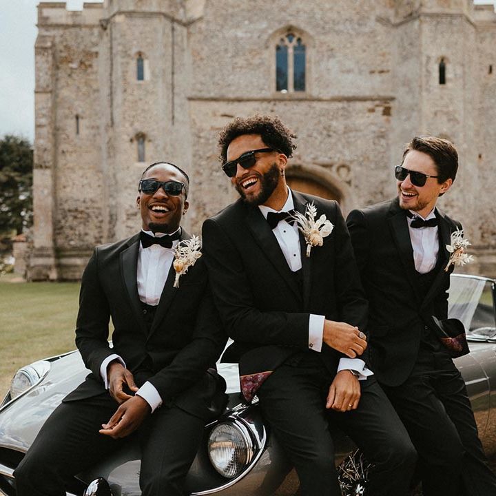 groomsmen and groom wearing black wedding sunglasses