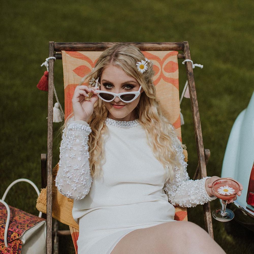 bride wearing short wedding dress and cat eye sunglasses