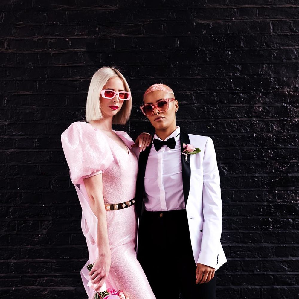 couple wearing statement pink wedding sunglasses