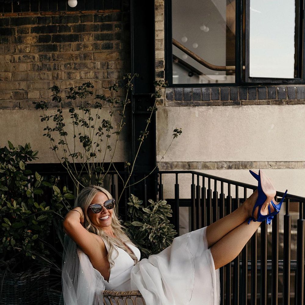 bride wearing wedding sunglasses for intimate wedding
