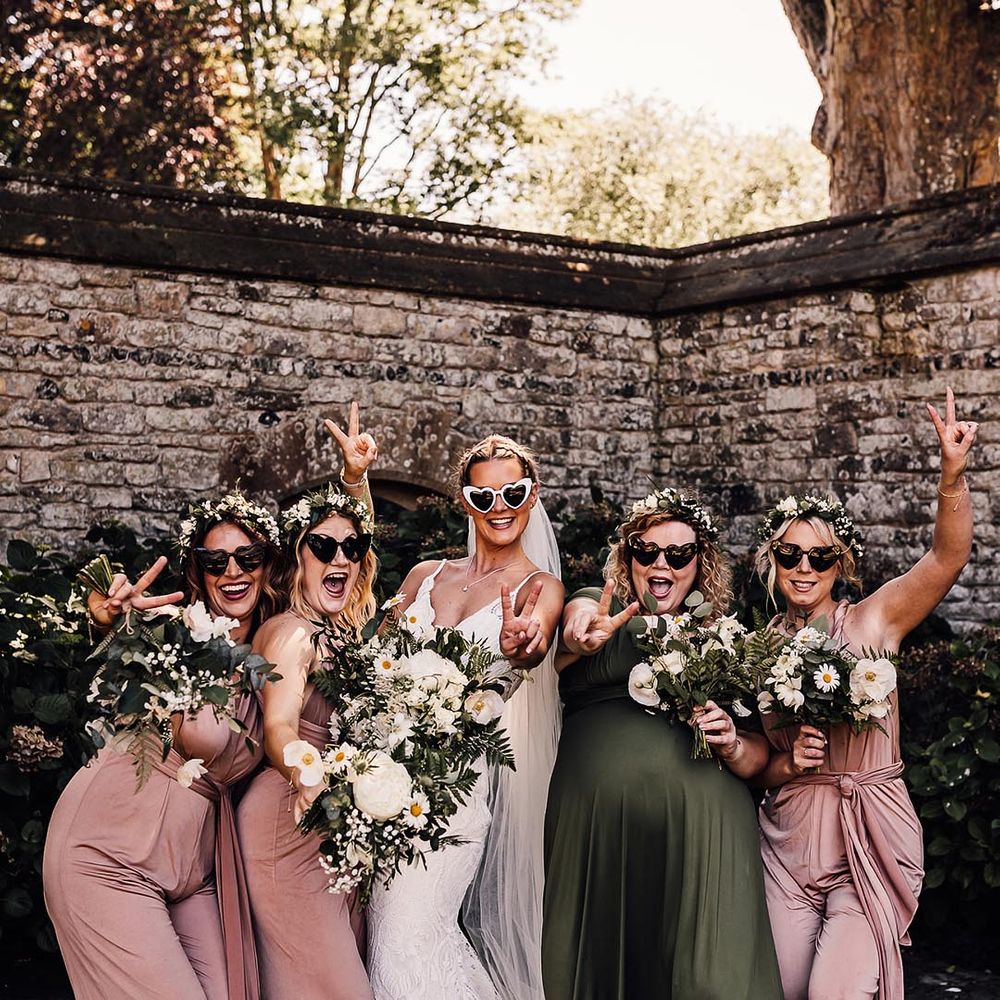 bridal party and bride wearing wedding sunglasses