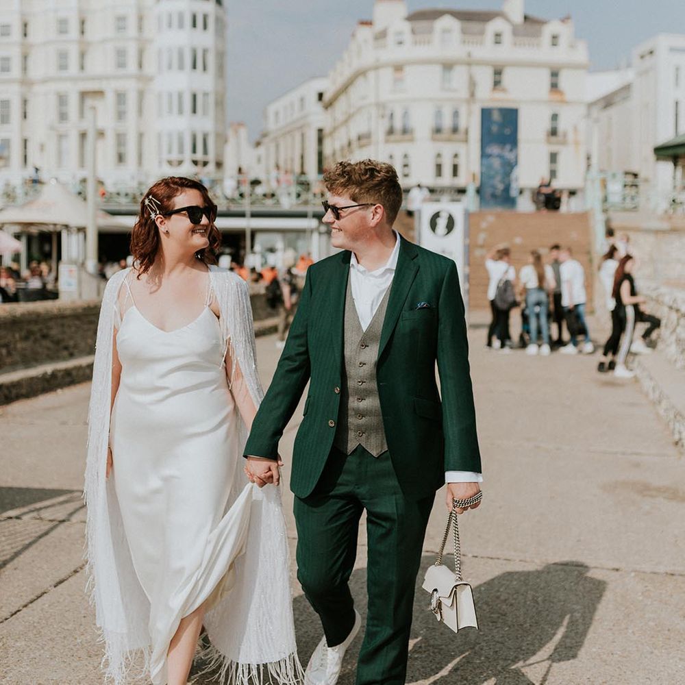 couple wearing wedding sunglasses for coastal wedding
