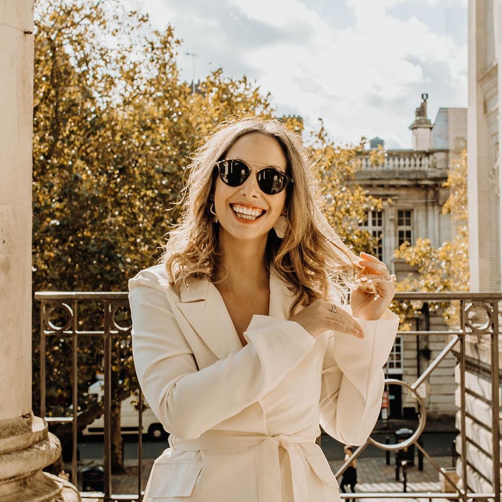 bride wearing sleek black wedding sunglasses 