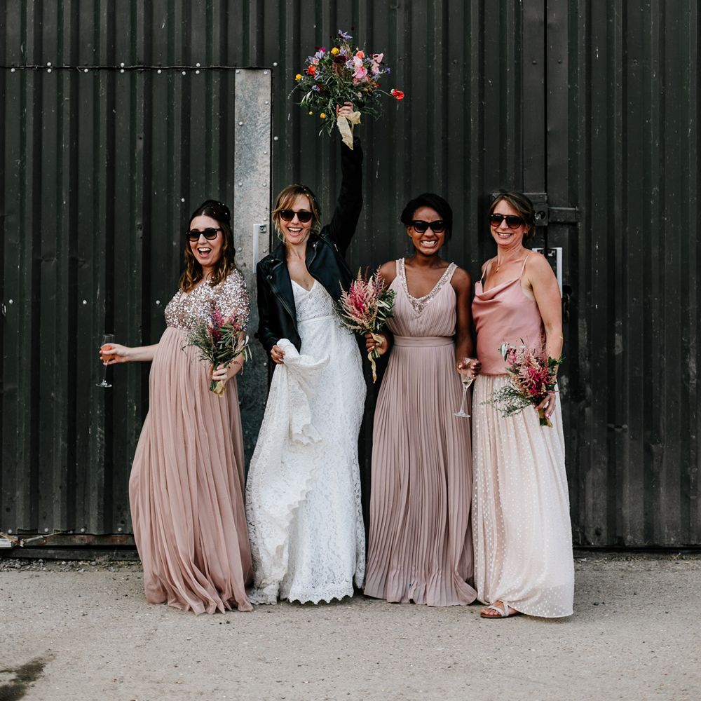 bridal party and bride wearing wedding sunglasses