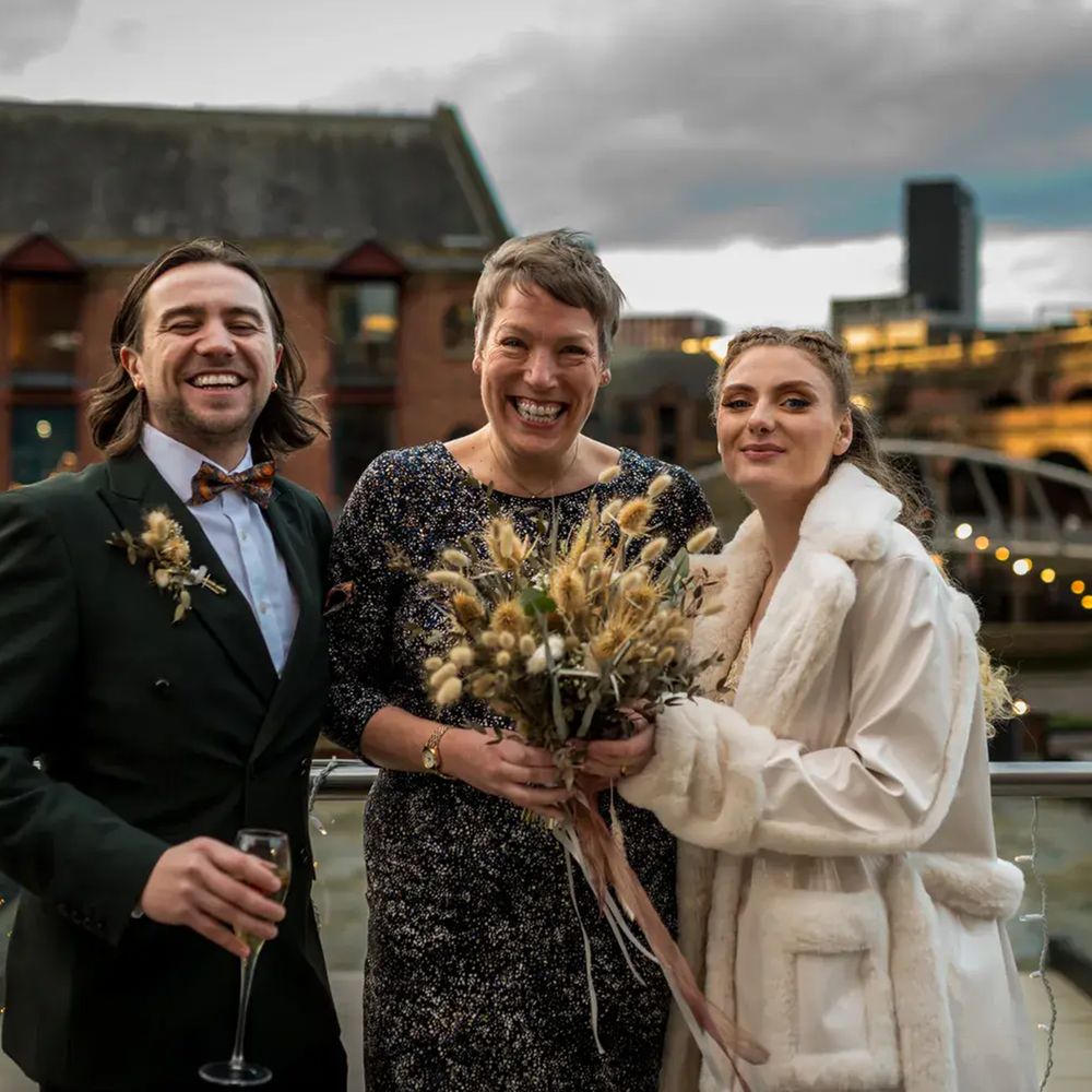 humanist celebrant with couple dried flower bouquet