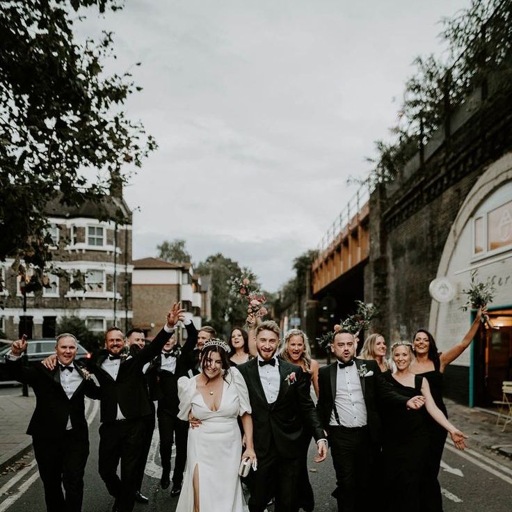 Wedding Party Wearing Black Wedding Outfits with Black Bridesmaid Dresses