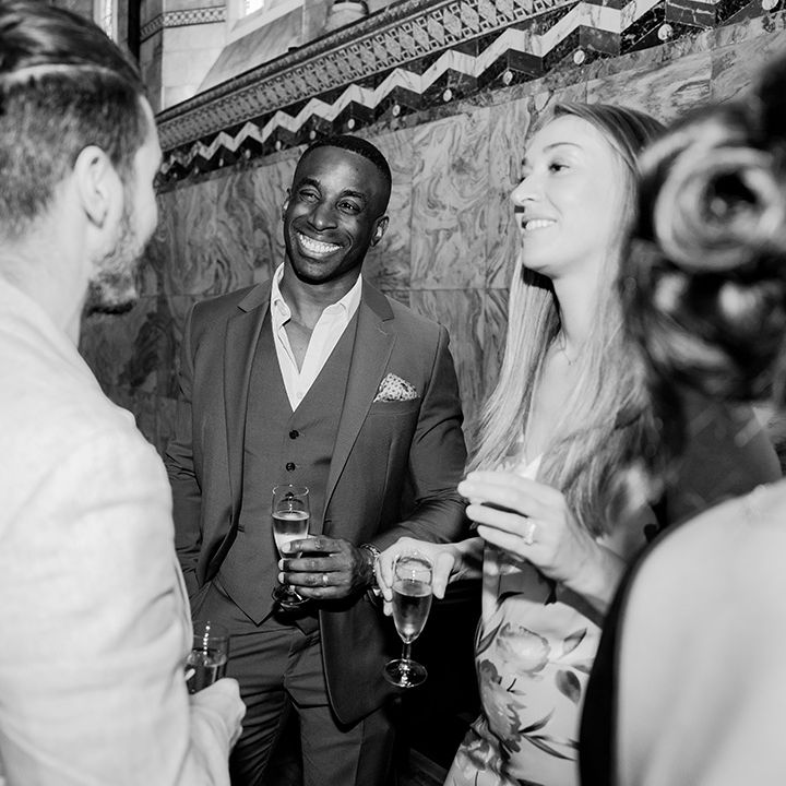 Wedding guests socialise at the wedding 