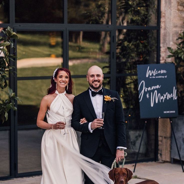 Bride & Groom Posing with Pet Dog