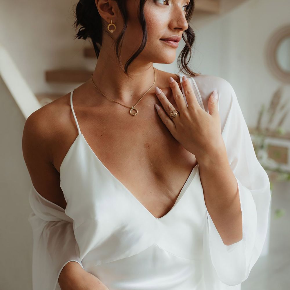 Bride wearing matching gold wedding jewellery set