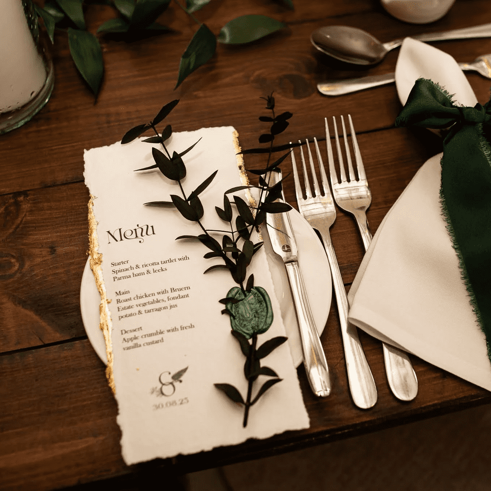 Festive greenery and old-fashioned looking stationery 