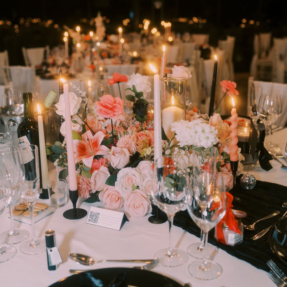 Pink pastel flower centrepiece with candles 