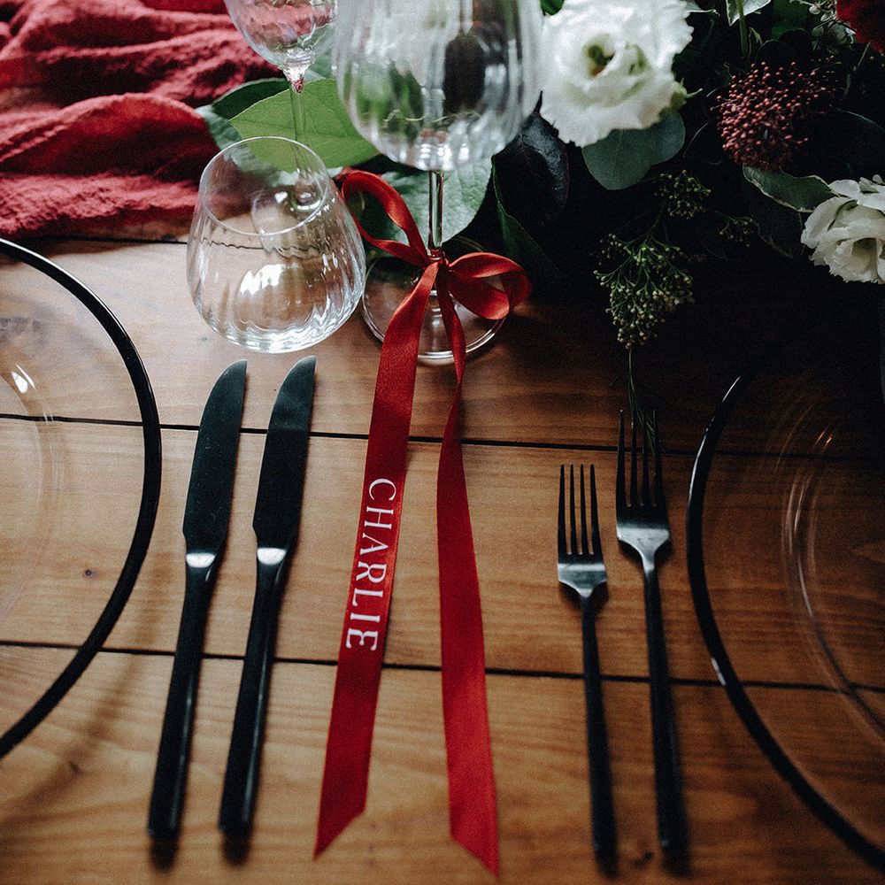 Winter tablescape with red bow ribbon place names 