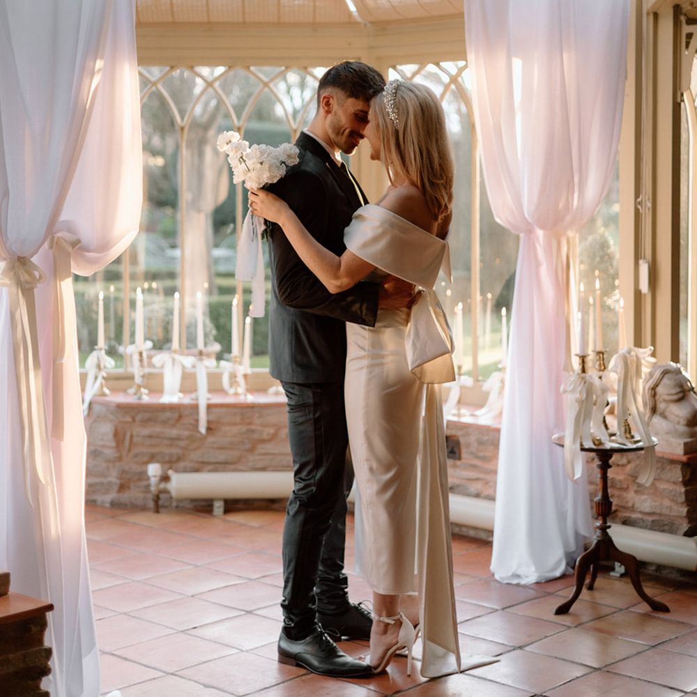 Couple has intimate moment in conservatory