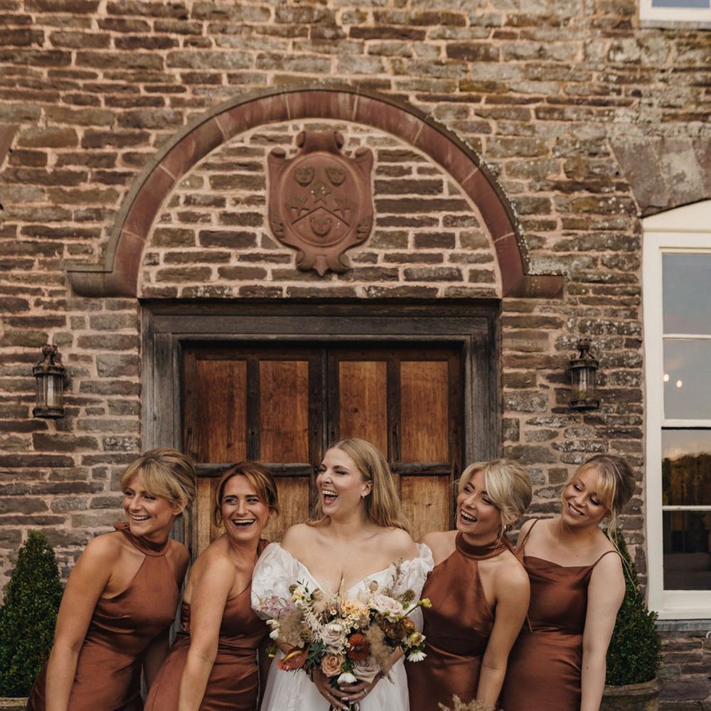 Bridal party wearing deep brown bridesmaid dresses