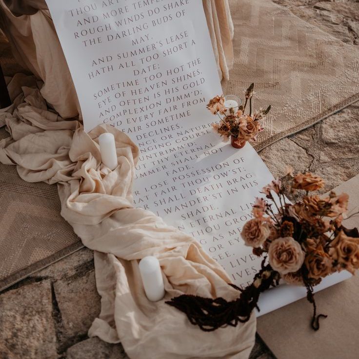 Fabric Wedding Signage With Neutral Flower Arrangements
