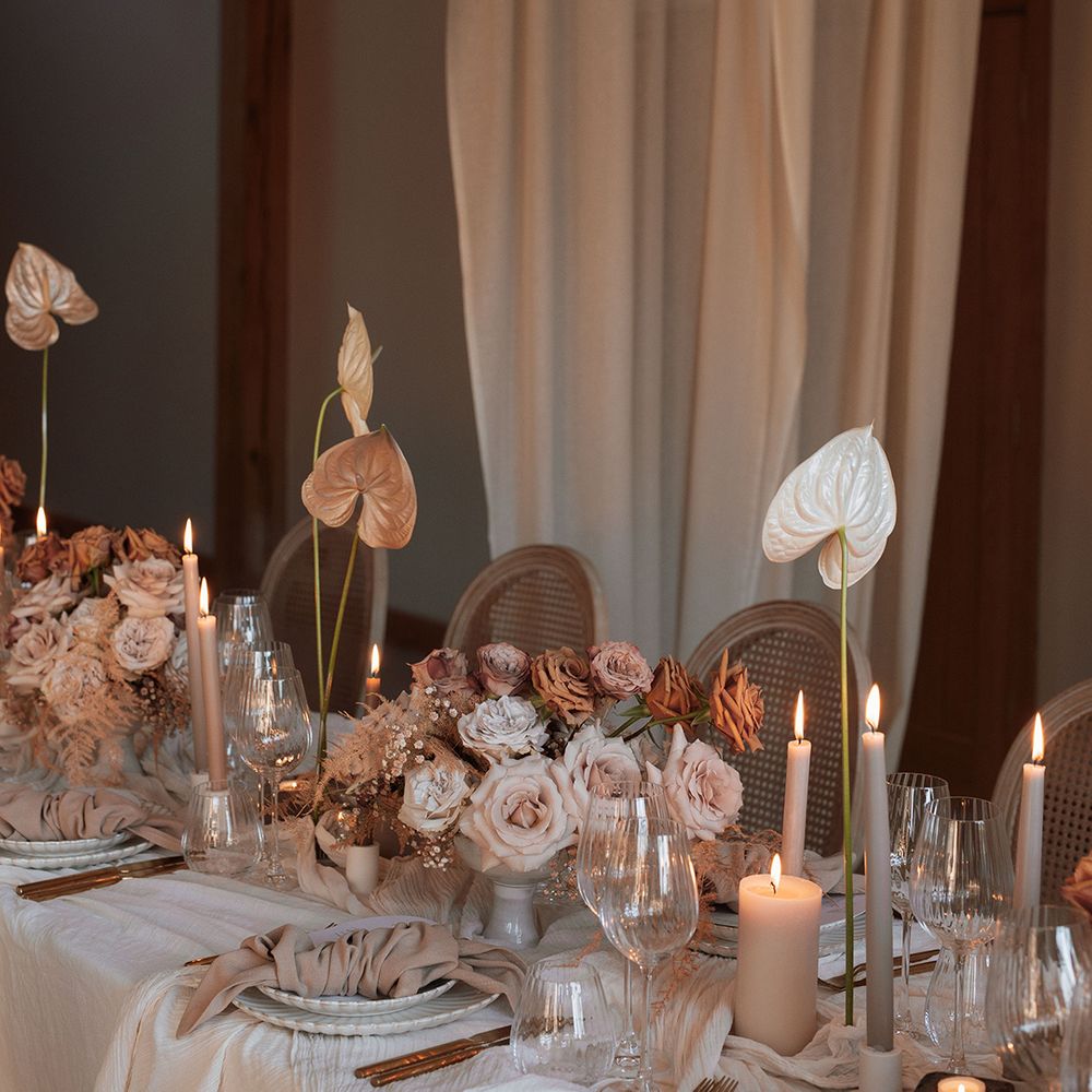 Neutral wedding tablescape with drapery 