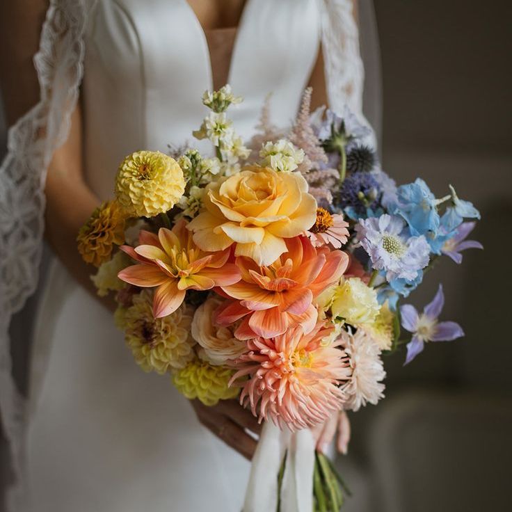 Bride Carries Pastel Rainbow Wedding Bouquet