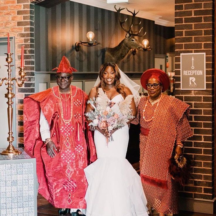 Bride in Mermaid Wedding Dress with Mother & Father of the Bride in Yoruba Wedding Attire