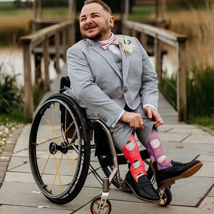 Groom in Light Blue Grey Wedding Suit with Colourful Mismatched Socks