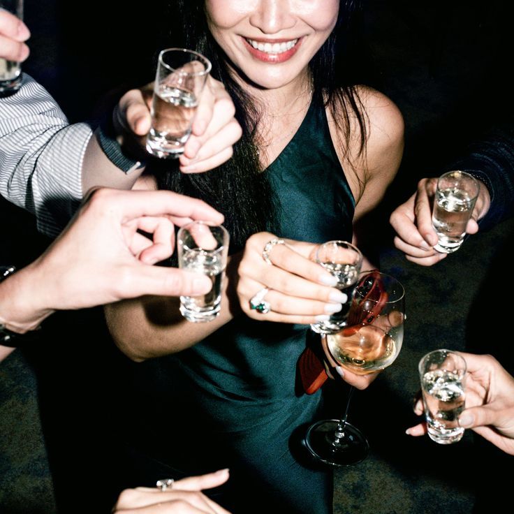 Wedding Guests Drinking Tequila Shots At Wedding Reception