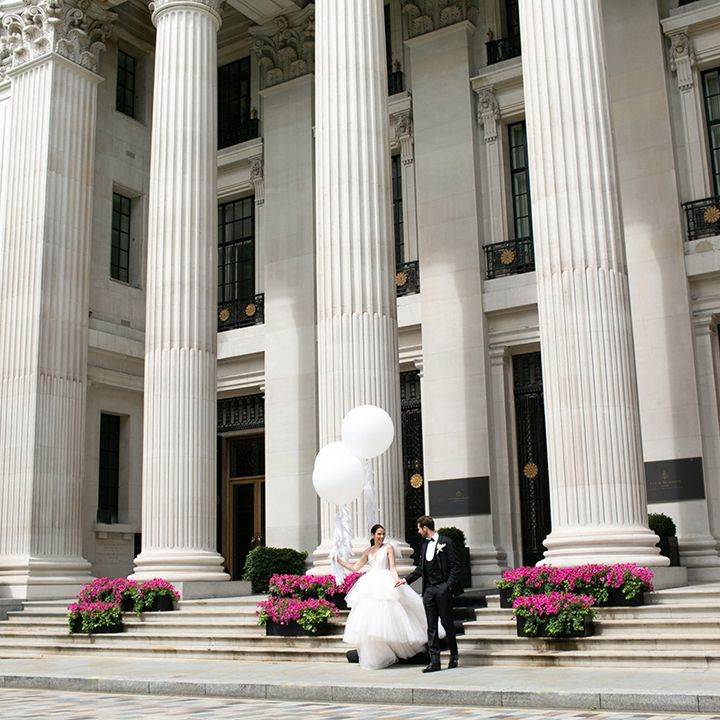 Bride and groom at the entrance to the Four Seasons Hotel in London
