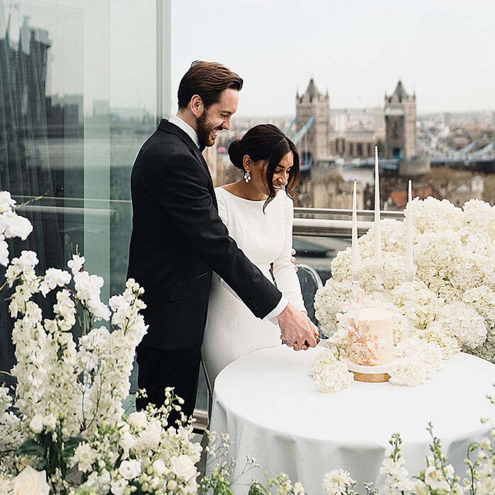 Bride and groom cut their wedding cake at the Four Seasons