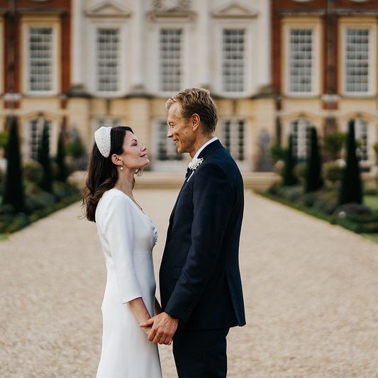 bride-and-groom-look-at-each-other-in-privy-garden.