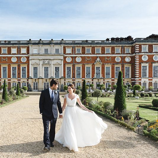 Couple Strolls in Privy Garden on wedding day 
