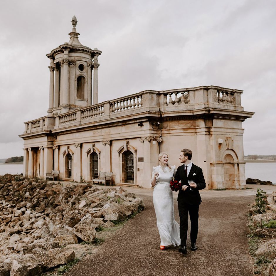 Bride and groom stroll around Normanton Church
