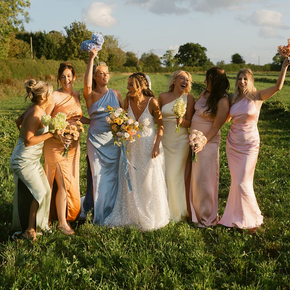 Bridal party in mismatched pastel bridesmaid dresses