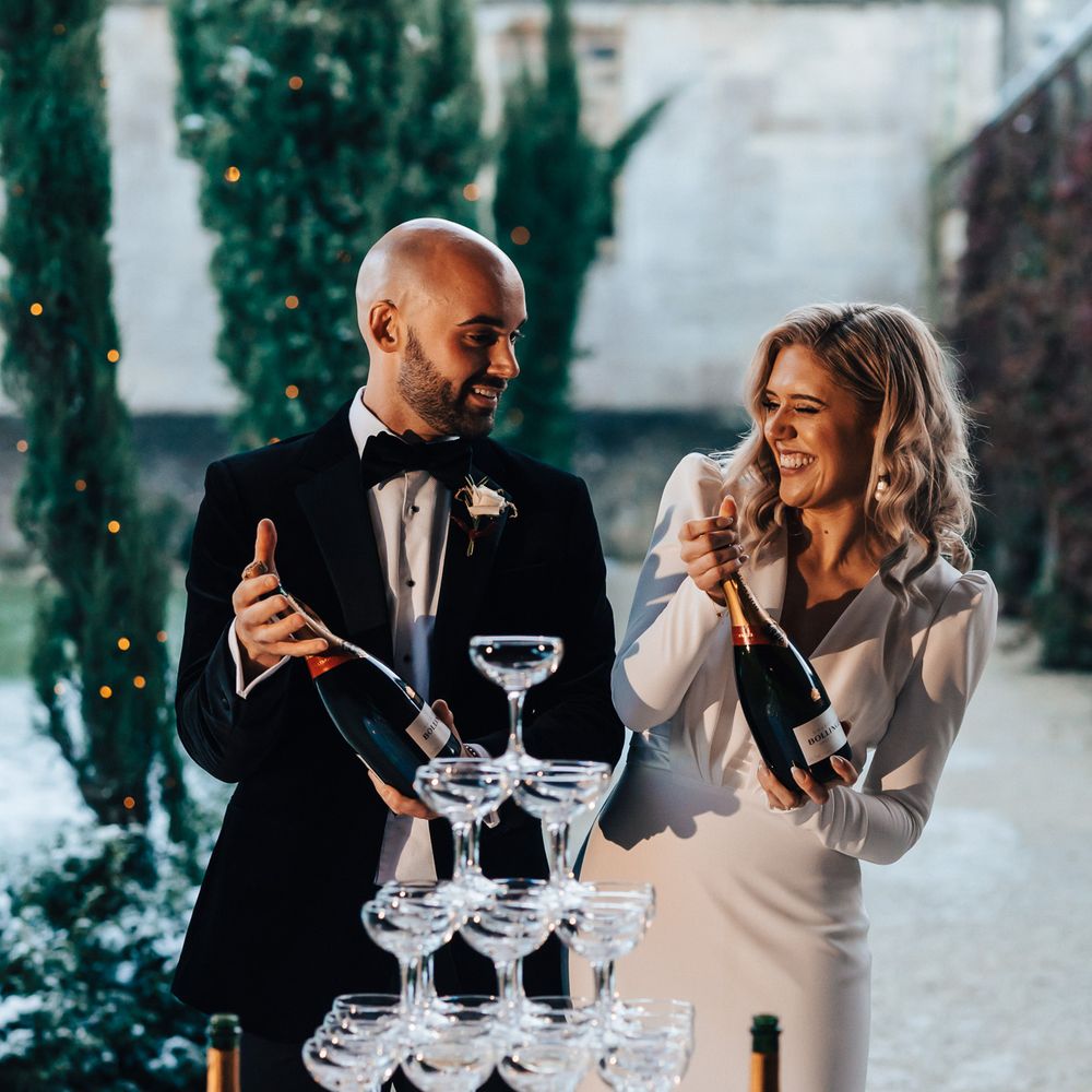 Bride and groom have their champagne tower moment