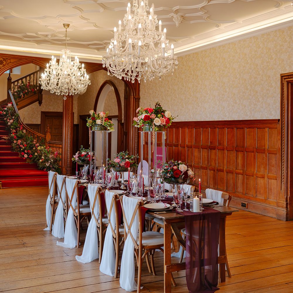 Red and gold festive wedding tablescape for intimate winter wedding