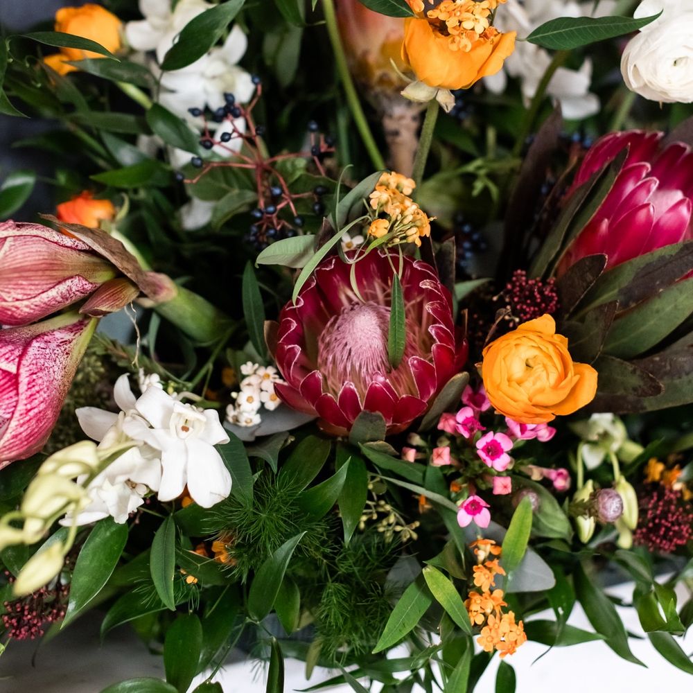Deep red, pink and yellow winter wedding flowers