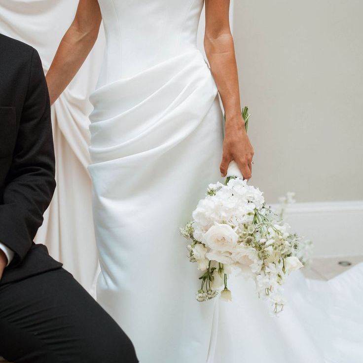 Bride In Off The Shoulder Wedding Dress With Ruched Detail