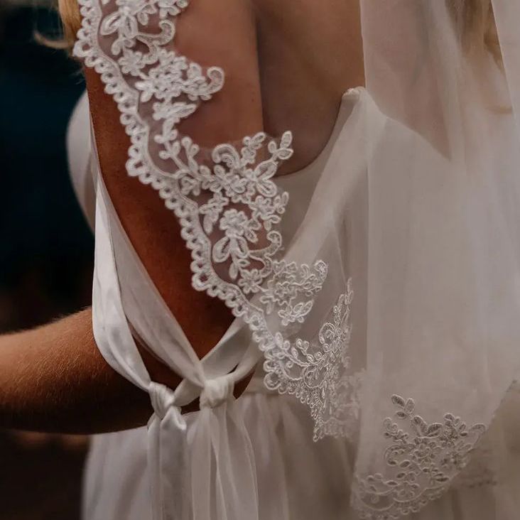 Bride Wearing Intricate Embroidered Edge Wedding Veil
