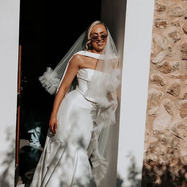 Bride Wearing Stylish Wedding Dress & Ruffle Veil
