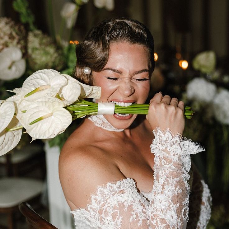 Bride in Delicate Long Sleeve Lace Wedding Dress