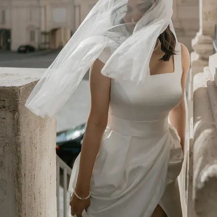 Bride in Square Neck Wedding Dress with Short Wedding Veil