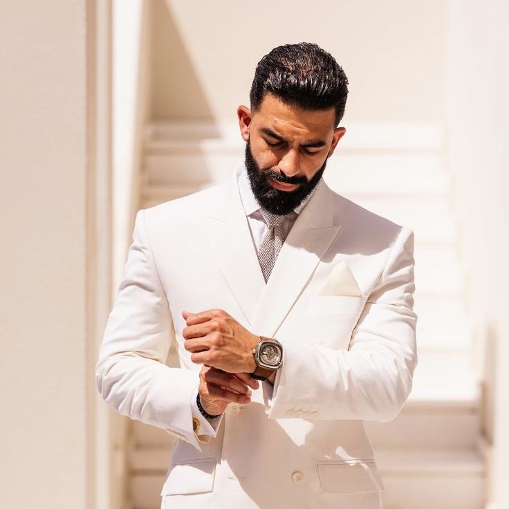 Groom in White Wedding Suit For Destination Wedding in Santorini