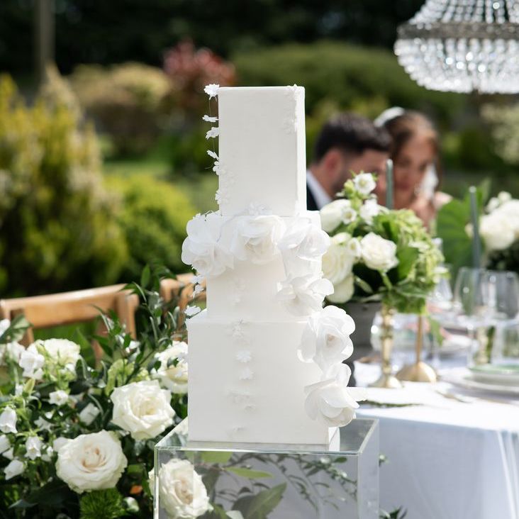 Modern White Iced Square Wedding Cake With White Roses