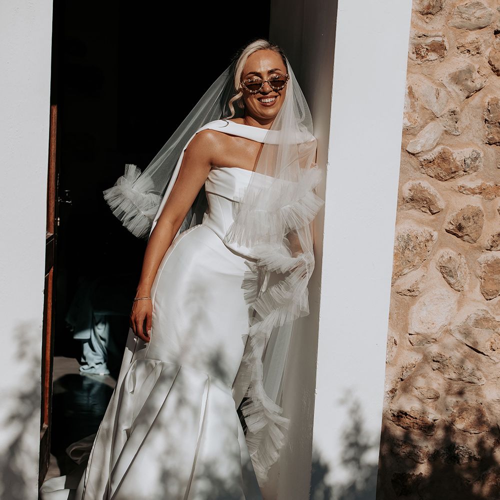 bride-in-strapless-fitted-mermaid-wedding-dress-with-ruffle-veil.