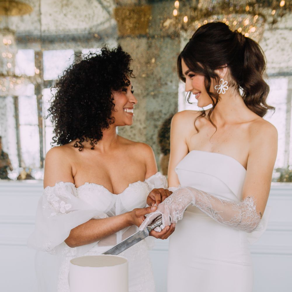 Brides cut their wedding cake 