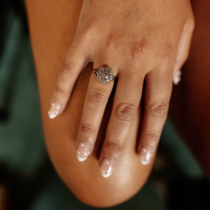 Bride Wearing Floral Vintage Engagement Ring with White French Tip Pearl Wedding Nails