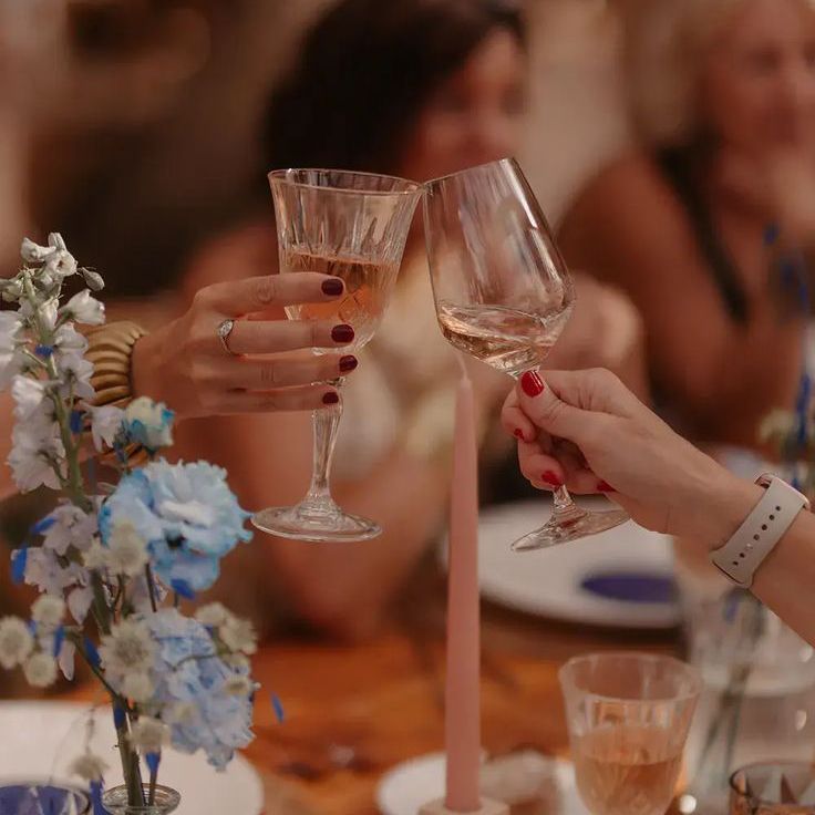 Cheers with wine glasses on date night