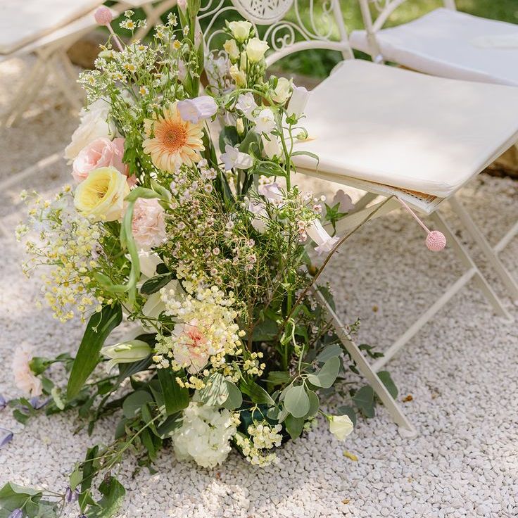 Pastel Wedding Flower Aisle Decor With White Ceremony Chairs