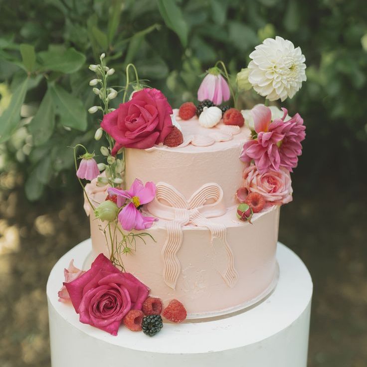 Two Tier Pastel Pink Wedding Cake with Pink Roses & Bows