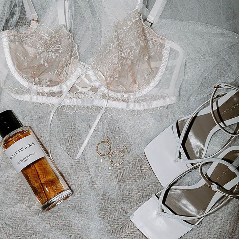 White lace bra, wedding perfume, veil and white Bottega heels