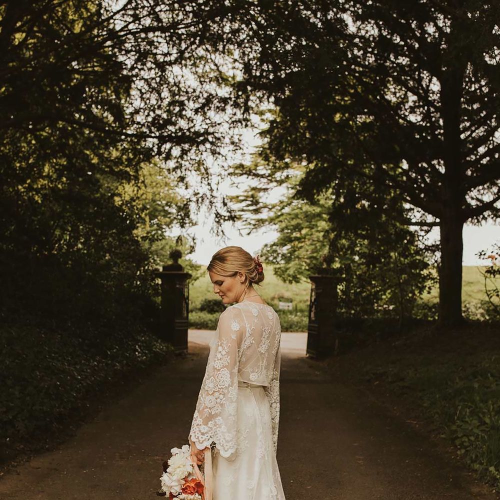 Bride in boho Lace wedding dress for sustainable wedding