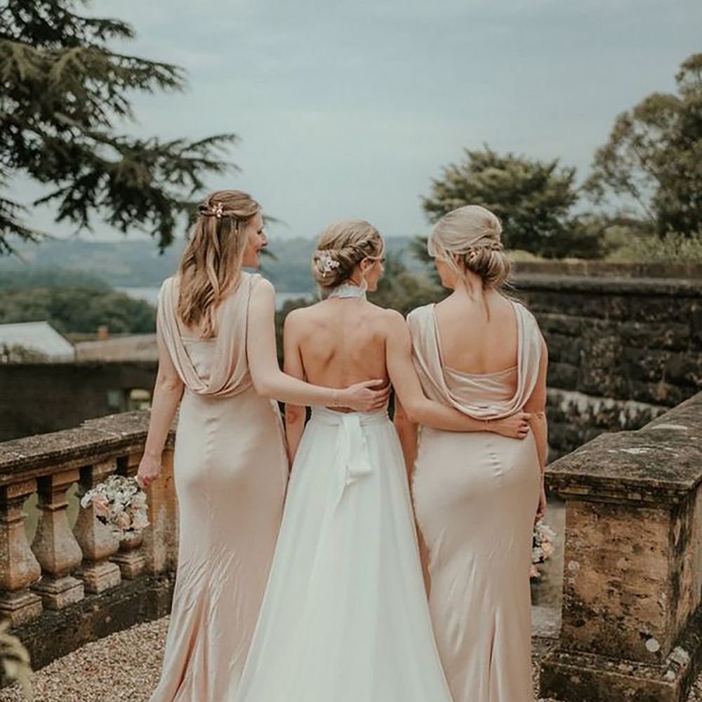 Bride in backless Stella McCartney sustainable wedding dress